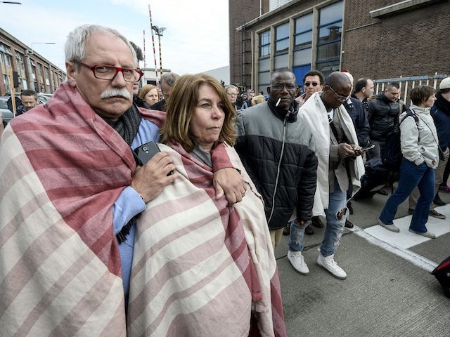 People are evacuated from Brussels airport in Zaventem on March 22, 2016 following twin blasts. A string of explosions rocked Brussels airport and a city metro station, killing at least 21 people in apparently coordinated attacks, officials said. == BELGIUM OUT == / AFP / Belga / DIRK WAEM / …