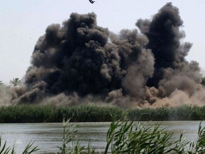 AD DULUIYAH, IRAQ - JULY 21: In this undated picture released by the U.S military on July 21, 2005, debris flies into the air after a 500 pound bomb dropped by the U.S. Air Force strikes a pontoon on a small island in the Tigris River near the town of …
