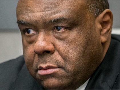Jean-Pierre Bemba takes his seat in the court room of the International Criminal Court in The Hague, Netherlands, Monday, March 21, 2016. The International Criminal Court is passing judgment on former Congolese vice president Bemba on charges of commanding a militia that went on a spree of murder, rape and …