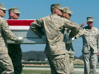 Marine Corps Lt. Gen. James Laster, director, Marine Corps Staff salutes at right as a Mar