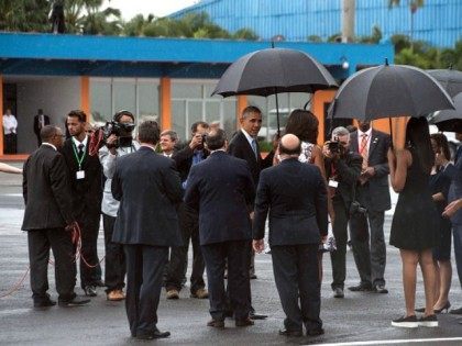 President Barack Obama (C), First Lady Michelle Obama (C, R back to camera) and daughters