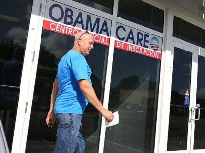 Alberto Abin walks out of the UniVista Insurance company office after shopping for a health plan under the Affordable Care Act, also known as Obamacare, on December 15, 2015 in Miami, Florida.