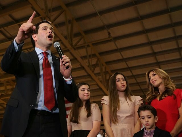 Republican presidential candidate Sen. Marco Rubio (R-FL) (L) speaks as daughters Amanda a