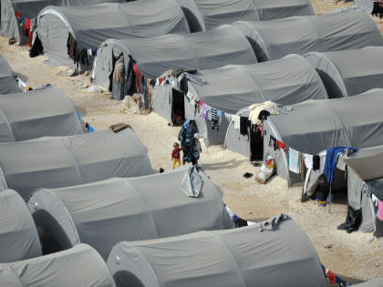 Kurdish refugees live in tents in a refugee camp