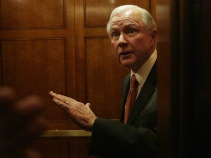 Sen. Jeff Sessions (R-AL) speaks to members of the media from inside an elevator after the