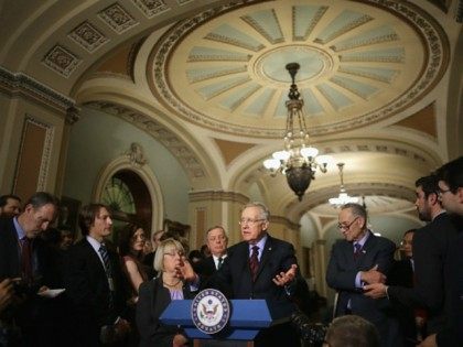 Senate Minority Leader Harry Reid (D-NV) (C) answers reporters' questions duirng a news conference with (L-R) Sen. Patty Murray (D-WA), Senate Minority Whip Richard Durbin (D-IL) and Sen. Charles Schumer (D-NY) following the weekly Senate Democratic policy luncheon in the U.S. Capitol December 8, 2015 in Washington, DC.