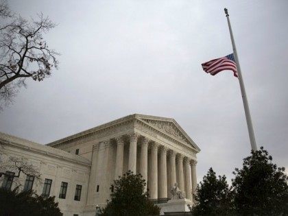 The American flag flies at half-staff at the U.S. Supreme Court, February 19, 2016 in Washington, DC.