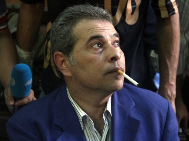 Egyptian talk show host Tawfiq Okasha attends his trial on charge of calling for the murde