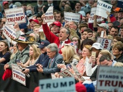 Caption:CONCORD, NC - MARCH 7: Donald Trump supporters cheer on the Republican presidential candidate before a campaign rally March 7, 2016 in Concord, North Carolina.