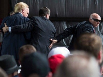 Secret Service swarms around Republican Presidential candidate Donald Trump after a bottle