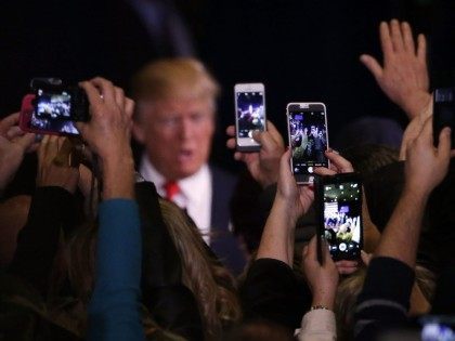 Trump and smartphones (Marcio Jose Sanchez / Associated Press)