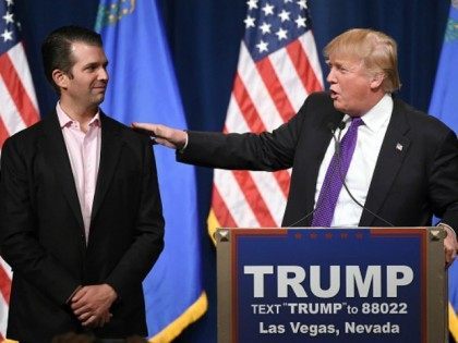 Donald Trump Jr. (L) looks on as his father, Republican presidential candidate Donald Trum