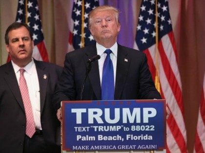 Republican Presidential frontrunner Donald Trump listens to a reporter's question at his Mar-A-Lago Club on Super Tuesday, March 1, 2016 in Palm Beach, Florida. Trump held a press conference, flanked by New Jersey Governor Chris Christie)