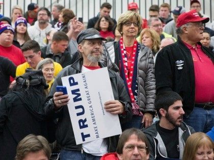 Guests wait for Republican presidential candidate Donald Trump to arrive for a rally at Ma