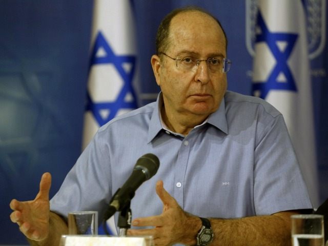 Israeli Defense Minister Moshe Ya'alon speaks during a press conference with Prime Mi