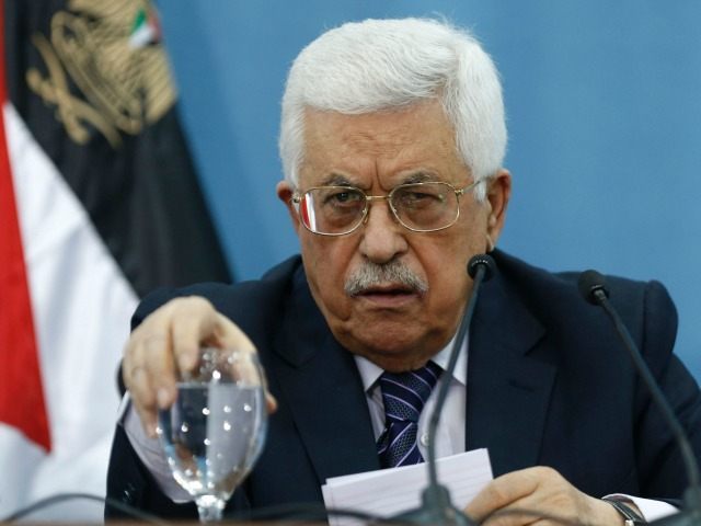 President Mahmoud Abbas reacts during a meeting with Palestinian journalists in the West B
