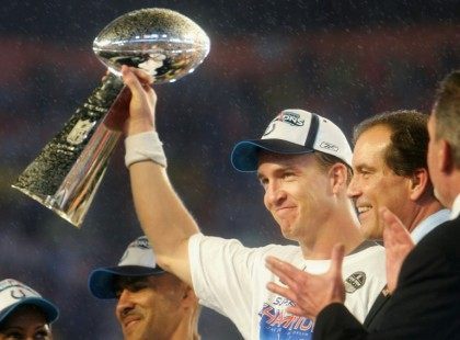 Quarterback Peyton Manning of the Indianapolis Colts celebrates with the Vince Lombardi Super Bowl trophy after winning the Super Bowl on February 4, 2007 in Miami Gardens, Florida