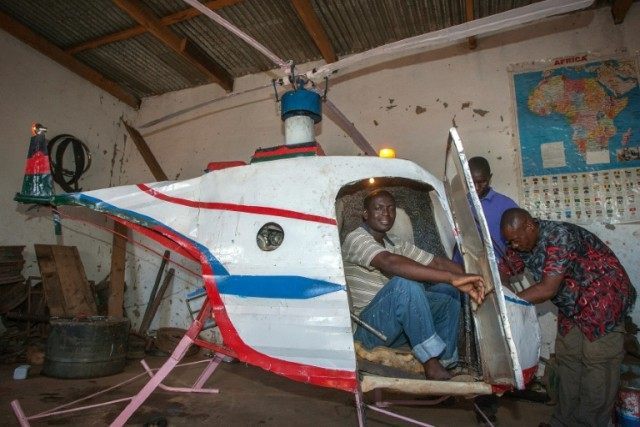 Felix Kambwiri sits in the cockpit of the helicopter he built during the last four months