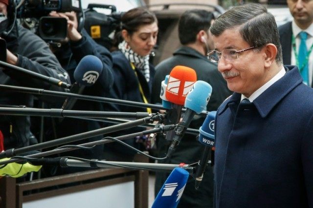 Turkish Prime Minister Ahmet Davutoglu arrives at a summit with EU leaders on the migrants