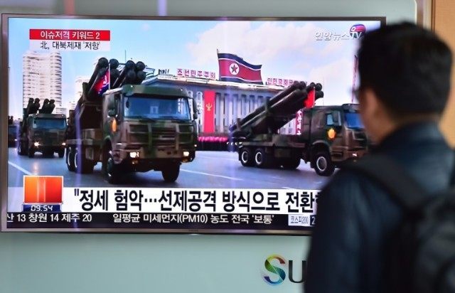 People in Seoul watch a news report on March 4, 2016 showing file footage of North Korean