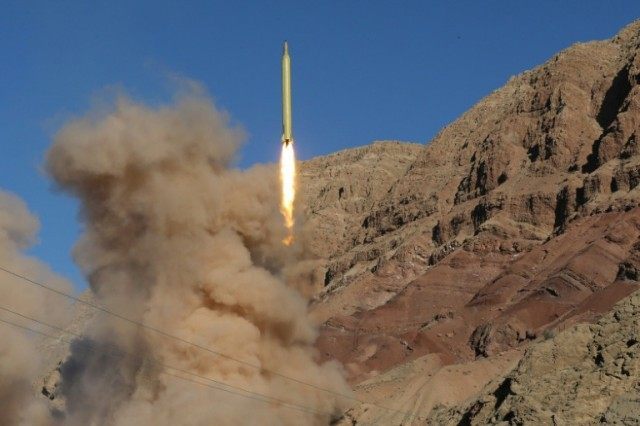 A long-range Qadr ballistic missile is launched in the Alborz mountain range in northern I