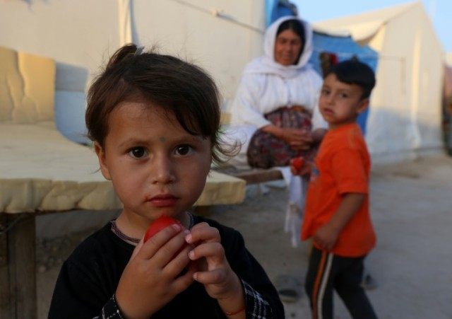 Displaced Iraqis from the Yazidi community, who fled violence between Islamic State group