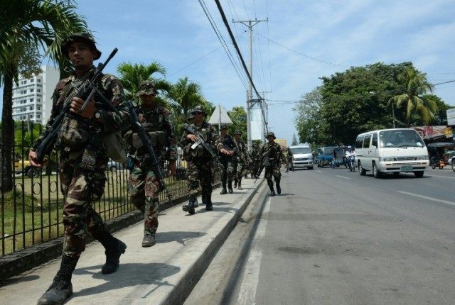 Philippine soldiers patrol the streets in Zamboanga, on southern island of Mindanao