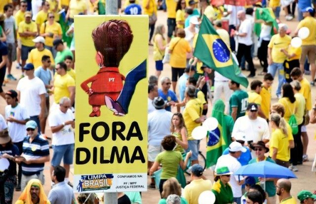 Opponents of the Brazilian government take part in a protest demanding the resignation of