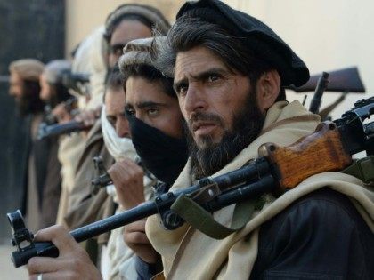 Afghan alleged former Taliban fighters hand over their weapons as part of a government pea