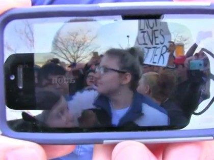 anti-Trump protester throws punch