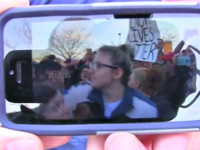 anti-Trump protester throws punch