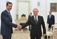 Vladimir Putin, Bashar Assad The Associated Press
