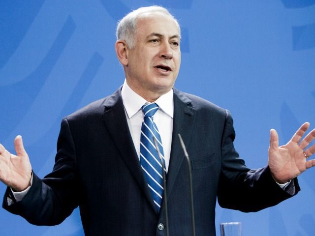 Israeli Prime Minister Benjamin Netanyahu gestures during a press conference together with