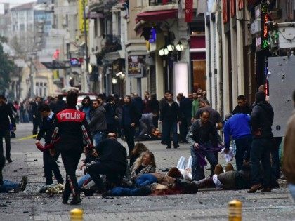 Graphic content / Injured people get assistance on the scene of an explosion on the pedestrian Istiklal avenue in Istanbul on March 19, 2016. A suicide bombing ripped through a famous shopping street in central Istanbul killing four people and injuring dozens less than a week after an attack by …