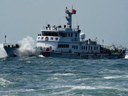 CHINA, XIAMEN : (150909) -- XIAMEN, Sept. 9, 2015 (Xinhua) -- A coast guard vessel attends