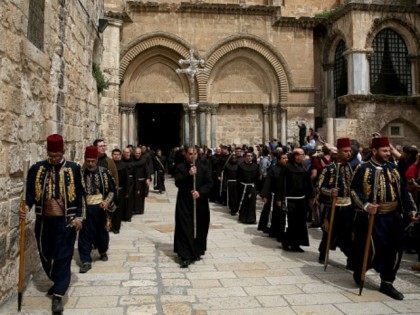 Kawases in traditional Ottoman outfits lead a procession of Roman Catholic clergymen as they leave the Church of the Holy Sepulchre in Jerusalem's Old City during Holy Thursday (Maundy Thursday) celebrations on March 24, 2016.
