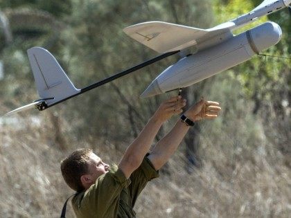 An Israel soldier prepares to launch an Israeli army's Skylark I unmanned drone aircraft, which is used for monitoring purposes on July 14, 2014 at an army deployment area near Israel's border with the Gaza Strip.