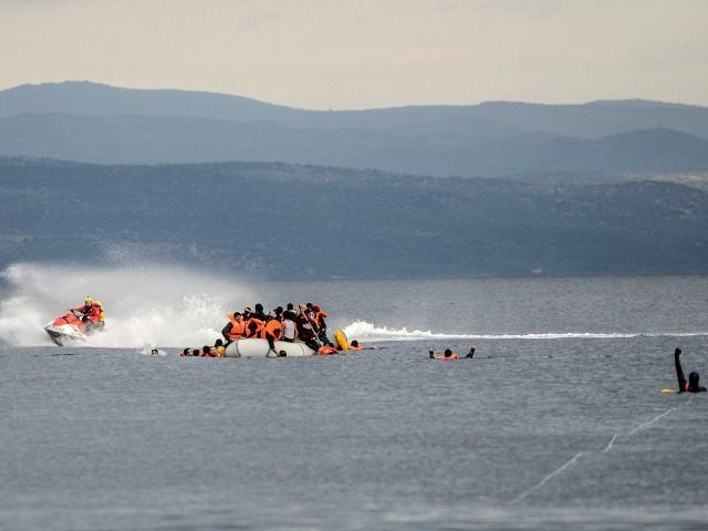 Migrants crammed on a huge inflatable rubber dinghy approaching the Greek island of Lesbos