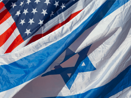 US and Israeli flags are seen as US Secretary of State John Kerry arrives in the Israeli coastal city of Tel Aviv on November 24, 2015