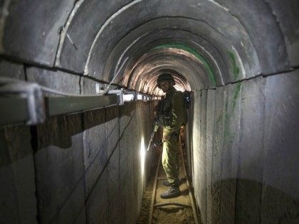 An Israeli army officer walks on July 25, 2014 during an army-organised tour in a tunnel s