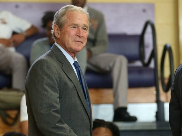 Former President George W. Bush attends an event at Warren Easton High School to mark the