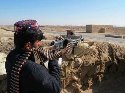 AFGHANISTAN, HELMAND : An Afghan Local Police (ALP) personnel keeps watch during an ongoing battle with Taliban militants in the Marjah district of Helmand Province on December 23, 2015. Military planes have dropped food and ammunition to besieged Afghan forces battling to push Taliban insurgents out of Sangin, officials said …