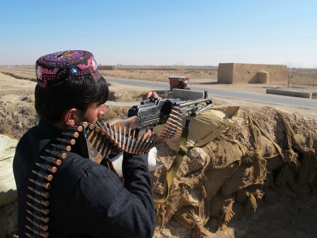 AFGHANISTAN, HELMAND : An Afghan Local Police (ALP) personnel keeps watch during an ongoin