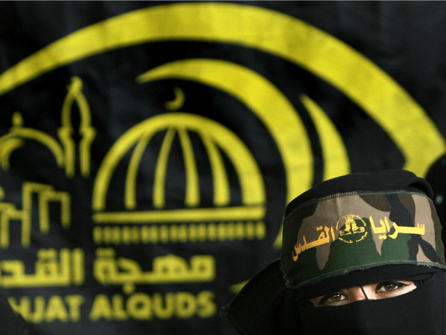 A Palestinian supporter of the Islamic Jihad movement attends a protest calling for the re