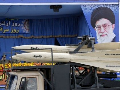 A military truck carrying Shalamcheh missiles drives past the presidential rostrum during the annual Army Day military parade on April 18, 2014 in Tehran. On the right is a portrait of Iran's supreme leader Ayatollah Ali Khamenei.