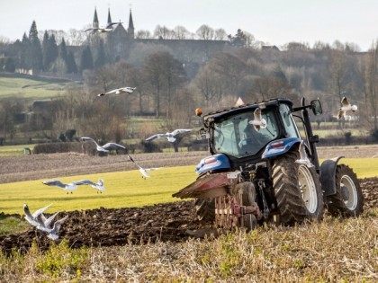 A farmer plows a field with a tractor on March 13, 2015 in Godewaersvelde, northern France.