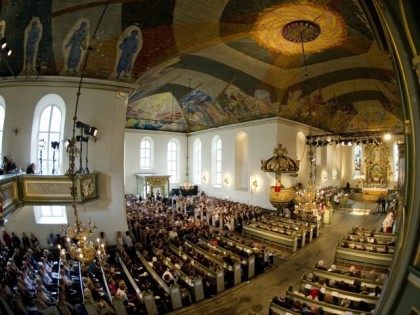 People attend on July 24, 2011 at the Domkirken cathedral in Oslo, a sombre mass for the v