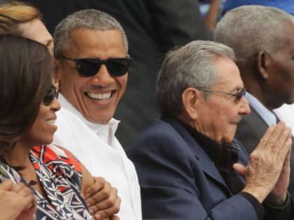HAVANA, CUBA - MARCH 22: (L-R) U.S. first lady Michelle Obama, President Barack Obama and Cuban President Raul Castro attend an exhibition game between the Cuban national baseball team and Major League Baseball's Tampa Bay Devil Rays at the Estado Latinoamericano March 22, 2016 in Havana, Cuba. This is the …
