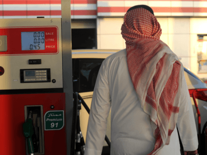 A Saudi man walks past a pump at a petrol station on December 28, 2015 in the Red Sea city of Jeddah. Saudi Arabia said it plans to review the prices of heavily-subsidised power and fuel as part of new measures introduced in the face of low oil prices.