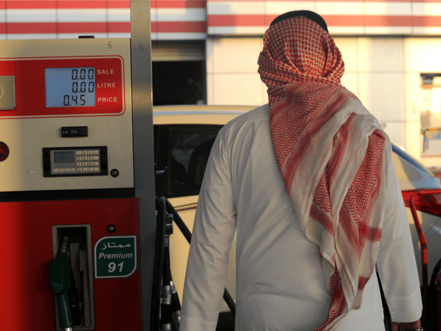 A Saudi man walks past a pump at a petrol station on December 28, 2015 in the Red Sea city